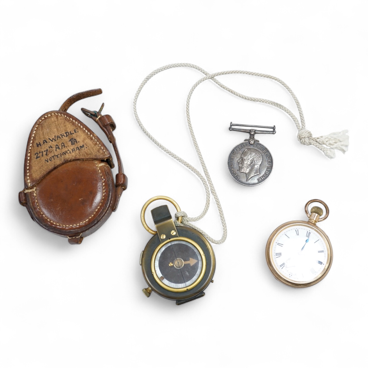 A cased WWI compass, an RG watch and a medal awarded to 33486 PTE. N. FRANCE. LING. R.